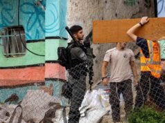 Eight Israelis held after assault on Palestinian village Eight Israelis held after assault on Palestinian village