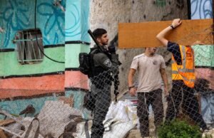 Eight Israelis held after assault on Palestinian village Eight Israelis held after assault on Palestinian village
