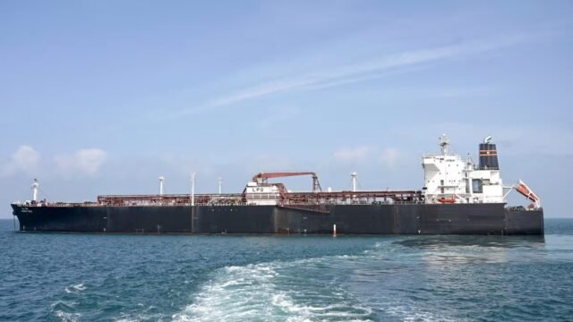 A woman talks on a phone while standing amid a damaged residential neighbourhood hit by a strike amid the US-Israeli conflict. (IMAGE: REUTERS) 